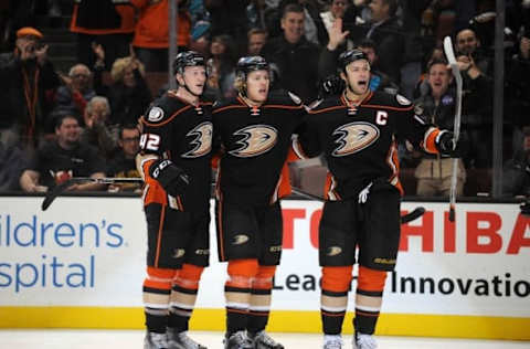 February 2, 2016; Anaheim, CA, USA; Anaheim Ducks defenseman Hampus Lindholm (47) celebrates with defenseman Josh Manson (42) and center Ryan Getzlaf (15) his goal scored against San Jose Sharks during the second period at Honda Center. Getzlaf recorded an assist on the goal. Mandatory Credit: Gary A. Vasquez-USA TODAY Sports