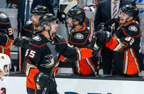 ANAHEIM, CA – MARCH 4: Marcus Pettersson #65 of the Anaheim Ducks celebrates with Jakob Silfverberg #33 on the bench after Pettersson scored his first NHL career goal against the Chicago Blackhawks on March 4, 2018. (Photo by Debora Robinson/NHLI via Getty Images)