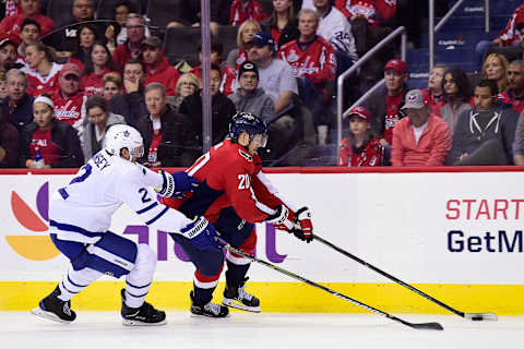 WASHINGTON, DC – OCTOBER 13: Lars Eller #20 of the Washington Capitals skates with the puck against Ron Hainsey #2 of the Toronto Maple Leafs in the third period at Capital One Arena on October 13, 2018 in Washington, DC. (Photo by Patrick McDermott/NHLI via Getty Images)