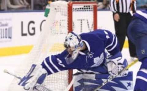 Oct 2, 2016; Toronto, Ontario, CAN; Toronto Maple Leafs goalie Garret Sparks (40) covers up on a loose puck against the Montreal Canadiens during a preseason hockey game at Air Canada Centre. The Maple Leafs beat the Canadiens 3-2 in overtime. Mandatory Credit: Tom Szczerbowski-USA TODAY Sports