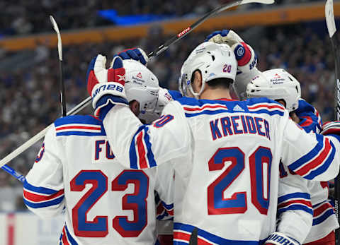 BUFFALO, NY – OCTOBER 12: Chris Kreider #20 of the New York Rangers celebrates withy teammates after scoring a goal against the Buffalo Sabres during the first period at KeyBank Center on October 12, 2023 in Buffalo, New York. (Photo by Kevin Hoffman/Getty Images)