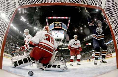 EDMONTON, AB – JUNE 17: Ryan Smyth #94 of the Edmonton Oilers celebrates after goaltender Cam Ward #30 of the Carolina Hurricanes fails to stop the first goal by Fernando Pisani #34 (not pictured) during the second period of game six of the 2006 NHL Stanley Cup Finals on June 17, 2006, at Rexall Place in Edmonton, Alberta, Canada. (Photo by Elsa/Getty Images)