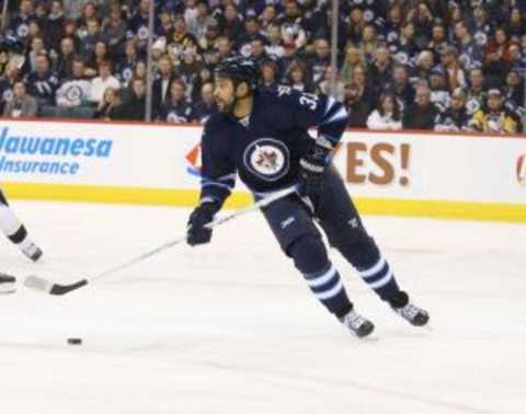 Dec 27, 2015; Winnipeg, Manitoba, CAN; Winnipeg Jets defenseman Dustin Byfuglien (33) during the first period against the Pittsburgh Penguins at MTS Centre. Mandatory Credit: Bruce Fedyck-USA TODAY Sports