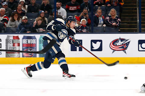 Oct 18, 2022; Columbus, Ohio, USA; Columbus Blue Jackets right wing Yegor Chinakhov (59) shoots against the Vancouver Canucks during overtime at Nationwide Arena. Mandatory Credit: Russell LaBounty-USA TODAY Sports