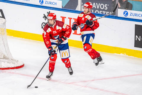 Kasper Halttunen of IFK Helsinki (L) in action followed by Chrisitan Kasastul (R) in Davos, Switzerland. (Photo by Jari Pestelacci/Eurasia Sport Images/Getty Images)