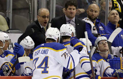 Nov 16, 2021; Pittsburgh, Pennsylvania, USA; Buffalo Sabres head coach Don Granato (left) talks to the Sabres during a time-out against the Pittsburgh Penguins in the third period at PPG Paints Arena. Buffalo won 2-1. Mandatory Credit: Charles LeClaire-USA TODAY Sports