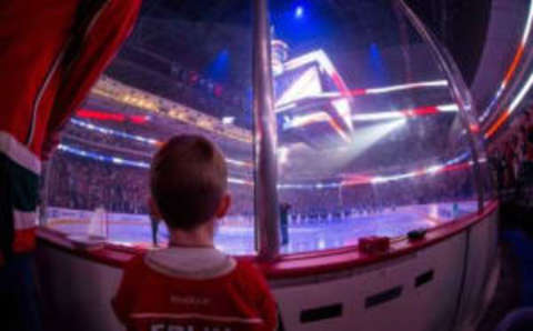 Oct 29, 2016; Saint Paul, MN, USA; A young fan listens to the national anthem before the game between Minnesota Wild and Dallas Stars at Xcel Energy Center. Mandatory Credit: Brad Rempel-USA TODAY Sports