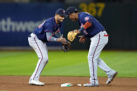 May 16, 2022; Oakland, California, USA; Minnesota Twins shortstop Royce Lewis (23) and second baseman Jorge Polanco (11) celebrate after defeating the Oakland Athletics at RingCentral Coliseum. Mandatory Credit: Darren Yamashita-USA TODAY Sports