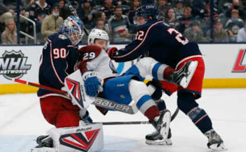 Nov 6, 2021; Columbus, Ohio, USA; Columbus Blue Jackets goalie Elvis Merzlikins (90) makes a save against Colorado Avalanche center Nathan MacKinnon (29) during the third period at Nationwide Arena. Mandatory Credit: Russell LaBounty-USA TODAY Sports