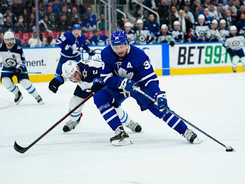 Toronto Maple Leafs, Auston Matthews (34); Winnipeg Jets, Dylan DeMelo (2). Mandatory Credit: John E. Sokolowski-USA TODAY Sports