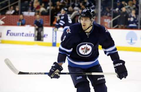 Jan 26, 2016; Winnipeg, Manitoba, CAN; Winnipeg Jets center Mark Scheifele (55) warms up prior to the game against the Arizona Coyotes at MTS Centre. Mandatory Credit: Bruce Fedyck-USA TODAY Sports