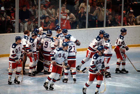 LAKE PLACID, NY – FEBRUARY 22: The United States Hockey team celebrates after they defeated the Soviet Union during a metal round game of the Winter Olympics February 22, 1980 at the Olympic Center in Lake Placid, New York. The game was named “The Miracle On Ice” as the United States defeated the Soviet Union 4-3. . (Photo by Focus on Sport/Getty Images) *** Local Caption ***