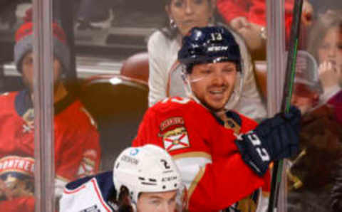 SUNRISE, FL – FEBRUARY 24: Andrew Peeke #2 of the Columbus Blue Jackets and Sam Reinhart #13 of the Florida Panthers come together behind the net in the second period at the FLA Live Arena on February 24, 2022 in Sunrise, Florida. (Photo by Joel Auerbach/Getty Images)