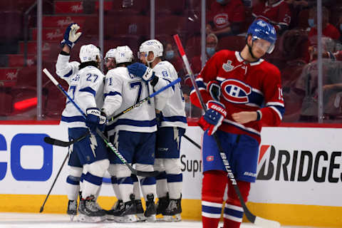 MONTREAL, QUEBEC – JULY 02: Jesperi Kotkaniemi #15 of the Montreal Canadiens skates by as Nikita Kucherov #86 of the Tampa Bay Lightning celebrates with teammates after scoring against Carey Price #31 during the second period in Game Three of the 2021 NHL Stanley Cup Final at Bell Centre on July 02, 2021 in Montreal, Quebec, Canada. (Photo by Bruce Bennett/Getty Images)