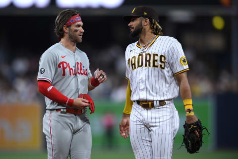 Aug 20, 2021; San Diego, California, USA; Philadelphia Phillies right fielder Bryce Harper (left) and San Diego Padres center fielder Fernando Tatis Jr. (right) talk during the middle of the sixth inning at Petco Park. Mandatory Credit: Orlando Ramirez-USA TODAY Sports