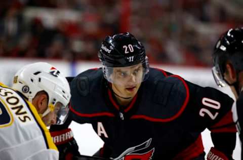 RALEIGH, NORTH CAROLINA – MAY 19: Sebastian Aho #20 of the Carolina Hurricanes looks to take the draw during the first period in Game Two of the First Round of the 2021 Stanley Cup Playoffs against the Nashville Predators at PNC Arena on May 19, 2021, in Raleigh, North Carolina. (Photo by Jared C. Tilton/Getty Images)