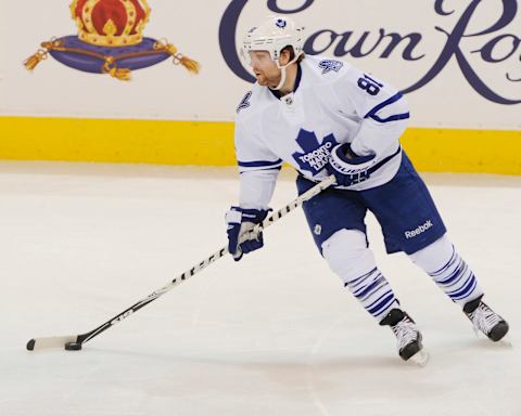 WINNIPEG, CANADA – JANUARY 3: Phil Kessel #81 of the Toronto Maple Leafs plays the puck down the ice during second period action against the Winnipeg Jets on January 3, 2015 at the MTS Centre in Winnipeg, Manitoba, Canada. The Jets defeated the Leafs 5-1. (Photo by Lance Thomson/NHLI via Getty Images)