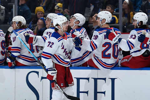 Filip Chytil #72 of the New York Rangers is congratulated by teammates