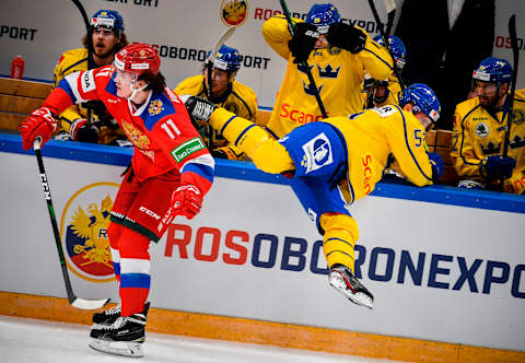 Russia’s forward Dmitry Voronkov (L). (Photo by Alexander NEMENOV / AFP) (Photo by ALEXANDER NEMENOV/AFP via Getty Images)