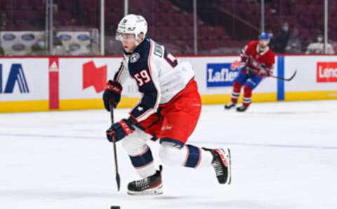 Jan 30, 2022; Montreal, Quebec, CAN; Columbus Blue Jackets right wing Yegor Chinakhov (59) plays the puck during the first period at Bell Centre. Mandatory Credit: David Kirouac-USA TODAY Sports