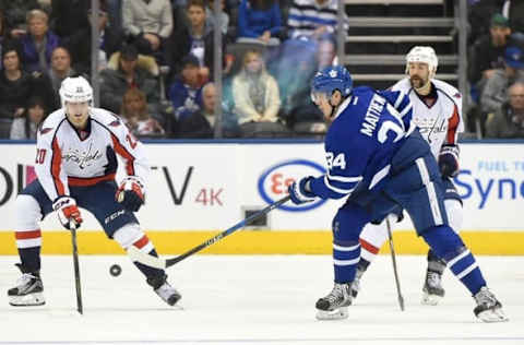 Nov 26, 2016; Toronto, Ontario, CAN; Toronto Maple Leafs forward Auston Matthews (34) shoots the puck past Washington Capitals forward Lars Eller (20) in the third period at Air Canada Centre. The Leafs won 4-2. Mandatory Credit: Dan Hamilton-USA TODAY Sports