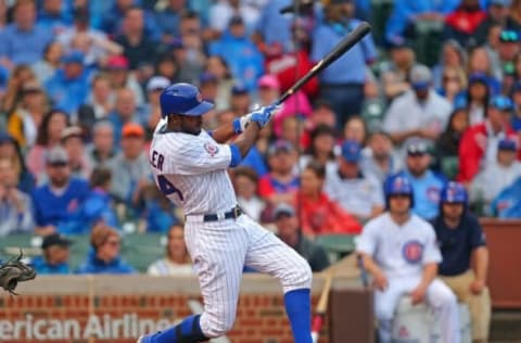 Jun 4, 2016; Chicago, IL, USA; Chicago Cubs center fielder Dexter Fowler (24) hits a single during the third inning against the Arizona Diamondbacks at Wrigley Field. Mandatory Credit: Dennis Wierzbicki-USA TODAY Sports