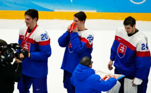 Feb 19, 2022; Beijing, China; Team Slovakia defender Samuel Knazko (22) celebrates winning the bronze medal menÕs ice hockey game against Sweden during the Beijing 2022 Olympic Winter Games at National Indoor Stadium. Slovakia won the game 4-0. Mandatory Credit: George Walker IV-USA TODAY Sports