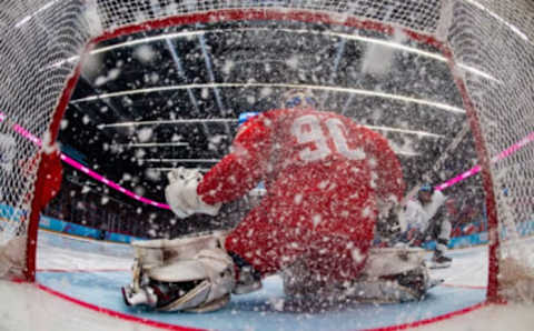 Jan 21, 2020; Lausanne, SWITZERLAND; Wide angle image from inside the net as Sergei Ivanov RUS makes a save to deny Gavin Brindley USA a goal in the RUS v USA Final of the Ice Hockey 6-Teams Men’s competition at the Vaudoise Arena. The Winter Youth Olympic Games. Mandatory Credit: Joel Marklund/OIS Handout Photo via USA TODAY Sports