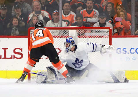 PHILADELPHIA, PENNSYLVANIA – MARCH 27: Sean Couturier #14 of the Philadelphia Flyers scores the game winning goal in the shoot-out against Frederik Andersen #31 of the Toronto Maple Leafs.. (Photo by Bruce Bennett/Getty Images)