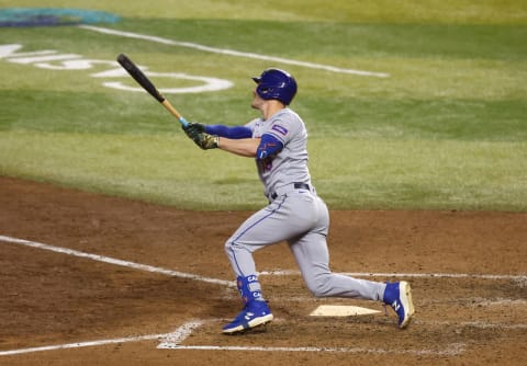 Jul 5, 2023; Phoenix, Arizona, USA; New York Mets designated hitter Mark Canha hits an RBI triple in the ninth inning against the Arizona Diamondbacks at Chase Field. Mandatory Credit: Mark J. Rebilas-USA TODAY Sports