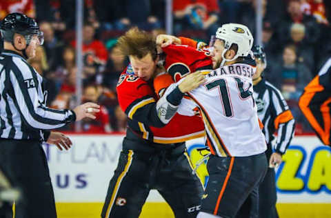 Dec 4, 2016; Calgary, Alberta, CAN; Calgary Flames right wing Alex Chiasson (39) and Anaheim Ducks left wing Joseph Cramarossa (74) fight during the third period at Scotiabank Saddledome. Calgary Flames won 8-3. Mandatory Credit: Sergei Belski-USA TODAY Sports