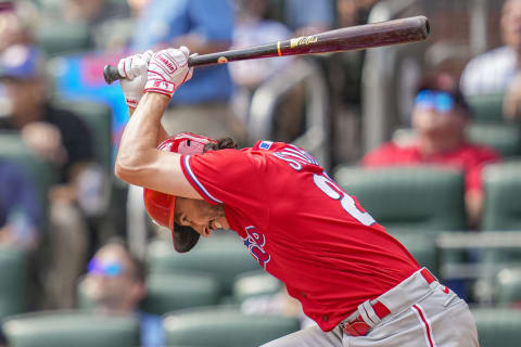 Sep 20, 2023; Cumberland, Georgia, USA; Philadelphia Phillies catcher Garrett Stubbs (21) slams his bat after posing up against the Atlanta Braves during the ninth inning at Truist Park. Mandatory Credit: Dale Zanine-USA TODAY Sports