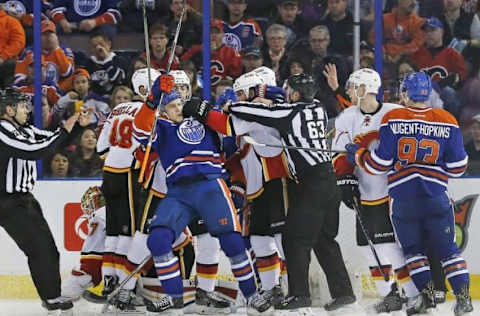 Apr 2, 2016; Edmonton, Alberta, CAN; /the Edmonton Oilers forward Leon Draisaitl (29) and Calgary Flames defensemen Deryk Engelland (29) tustle in front of the Calgary Flames net during the second period at Rexall Place. Mandatory Credit: Perry Nelson-USA TODAY Sports