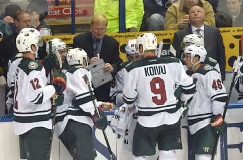 ST. LOUIS, MO – NOVEMBER 26: Minnesota Wild head coach Bruce Boudreau looks up at the scoreboard as assistant coach John Anderson talks to the team during a time out during a NHL game between the Minnesota Wild and the St. Louis Blues on November 26, 2016, at Scottrade Center in St. Louis, MO. The Blues won in a shootout 4-3. (Photo by Keith Gillett/Icon Sportswire via Getty Images)