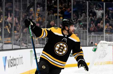 Mar 12, 2022; Boston, Massachusetts, USA; Boston Bruins center Craig Smith (12) celebrates after scoring a goal against the Arizona Coyotes during the first period at the TD Garden. Mandatory Credit: Brian Fluharty-USA TODAY Sports