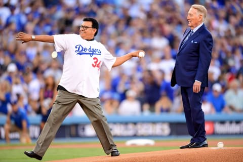 LOS ANGELES, CA – OCTOBER 25: Former Los Angeles Dodgers player Fernando Valenzuela throws out the ceremonial first pitch as former Los Angeles Dodgers broadcaster Vin Scully looks on before game two of the 2017 World Series between the Houston Astros and the Los Angeles Dodgers at Dodger Stadium on October 25, 2017 in Los Angeles, California. (Photo by Harry How/Getty Images)