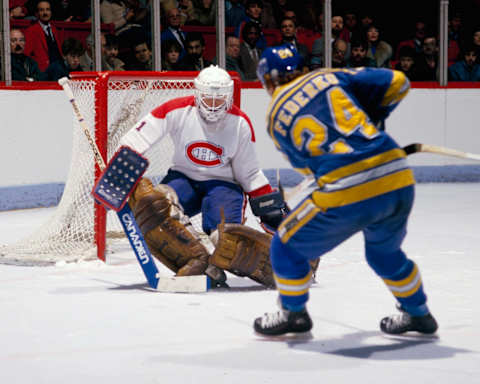 MONTREAL, CANADA- CIRCA 1982: Rick Wamsley #1 of the Montreal Canadiens saves a shot by Bernie Federko #24 of the St. Louis Blues Circa 1982 at the Montreal Forum in Montreal, Quebec, Canada. (Photo by Denis Brodeur/NHLI via Getty Images)