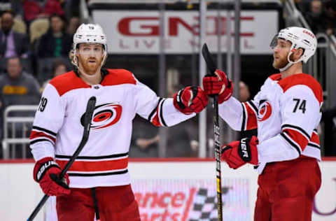 PITTSBURGH, PA – MARCH 31: Carolina Hurricanes Defenseman Jaccob Slavin (74) celebrates his goal with Carolina Hurricanes Defenseman Dougie Hamilton (19) during the third period in the NHL game between the Pittsburgh Penguins and the Carolina Hurricanes on March 31, 2019, at PPG Paints Arena in Pittsburgh, PA. (Photo by Jeanine Leech/Icon Sportswire via Getty Images)