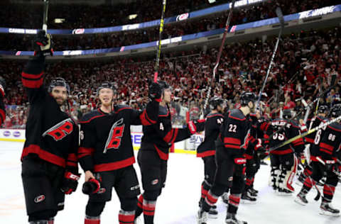 RALEIGH, NC – MAY 03: Jordan Martinook #48 of the Carolina Hurricanes and teammate Patrick Brown #36 celebrate following a victory over the New York Islanders in Game Four of the Eastern Conference Second Round during the 2019 NHL Stanley Cup Playoffs on May 3, 2019 at PNC Arena in Raleigh, North Carolina. (Photo by Gregg Forwerck/NHLI via Getty Images)