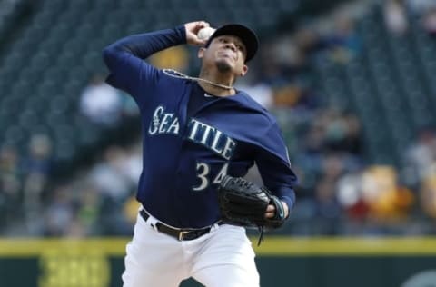 Oct 2, 2016; Seattle, WA, USA; Seattle Mariners starting pitcher Felix Hernandez (34) throws against the Oakland Athletics during the first inning at Safeco Field. Mandatory Credit: Jennifer Buchanan-USA TODAY Sports