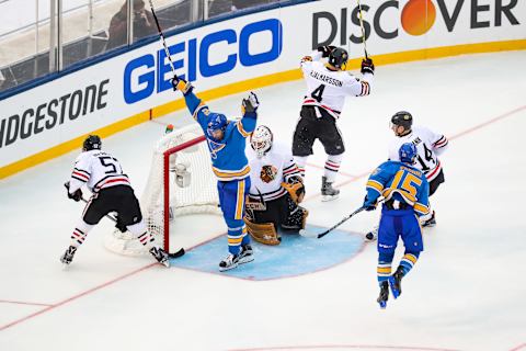 ST. LOUIS, MO – JANUARY 02: St. Louis Blues Center Jori Lehtera (12) raises his hands in celebration and St. Louis Blues Winger Robby Fabbri (15) leaps through the air on a goal that was scored by St. Louis Blues Right Wing Vladimir Tarasenko (91) (not pictured) during the third period of a NHL Winter Classic hockey game between the Chicago Blackhawks and the St. Louis Blues. The Blues defeated the Blackhawks 4-1 on January 2, 2017, at Busch Stadium in St. Louis, MO. (Photo by Tim Spyers/Icon Sportswire via Getty Images)