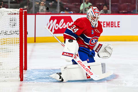 Sep 27, 2023; Montreal, Quebec, CAN; Montreal Canadiens goalie Jake Allen (34) makes a save against the Ottawa Senators during the first period at Bell Centre. Mandatory Credit: David Kirouac-USA TODAY Sports