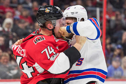 Apr 8, 2017; Ottawa, Ontario, CAN; Ottawa Senators defenseman Mark Borowiecki (74) fights with New York Rangers left wing Tanner Glass (15) in the first period at Canadian Tire Centre. Mandatory Credit: Marc DesRosiers-USA TODAY Sports