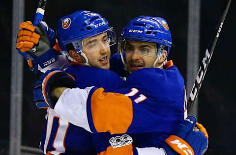 NHL Power Rankings: New York Islanders center Alan Quine (10) is congratulated by center Shane Prince (11) after scoring a goal against the Philadelphia Flyers during the second period at Barclays Center. Mandatory Credit: Andy Marlin-USA TODAY Sports