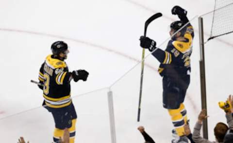 Apr 23, 2017; Boston, MA, USA; Boston Bruins left wing Brad Marchand (63) celebrates with right wing Drew Stafford (19) after a goal during the first period of game six of the first round of the 2017 Stanley Cup Playoffs against the Ottawa Senators at TD Garden. Mandatory Credit: Greg M. Cooper-USA TODAY Sports