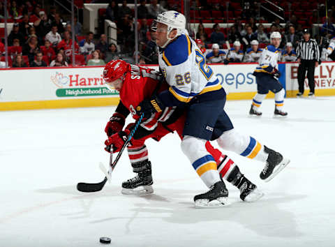 RALEIGH, NC – OCTOBER 27: Jeff Skinner #53 of the Carolina Hurricanes has his stick lifted as he is muscled away from the puck by Paul Stastny #26 of the St. Louis Blues during an NHL game on October 27, 2017 at PNC Arena in Raleigh, North Carolina. (Photo by Gregg Forwerck/NHLI via Getty Images)