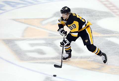 May 21, 2017; Pittsburgh, PA, USA; Pittsburgh Penguins center Jake Guentzel (59) skates with the puck against the Ottawa Senators during the second period in game five of the Eastern Conference Final of the 2017 Stanley Cup Playoffs at the PPG PAINTS Arena. Mandatory Credit: Charles LeClaire-USA TODAY Sports