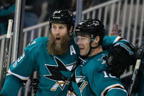 Jan 31, 2017; San Jose, CA, USA; San Jose Sharks left wing Patrick Marleau (12) celebrates with center Joe Thornton (19) after scoring a goal against the Chicago Blackhawks in the second period at SAP Center at San Jose. Mandatory Credit: John Hefti-USA TODAY Sports