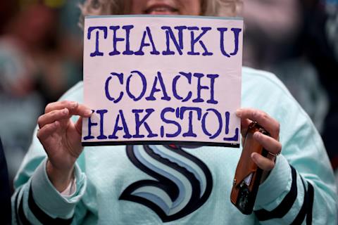 SEATTLE, WASHINGTON – APRIL 22: A fan holds a sign thanking head coach Dave Hakstol before Game Three of the First Round of the 2023 Stanley Cup Playoffs against the Colorado Avalanche at Climate Pledge Arena on April 22, 2023 in Seattle, Washington. (Photo by Steph Chambers/Getty Images)