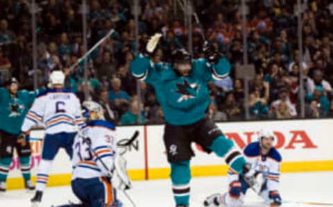 San Jose Sharks right wing Joel Ward (42) reacts to the San Jose Sharks’ unique teal jerseys (John Hefti-USA TODAY Sports)